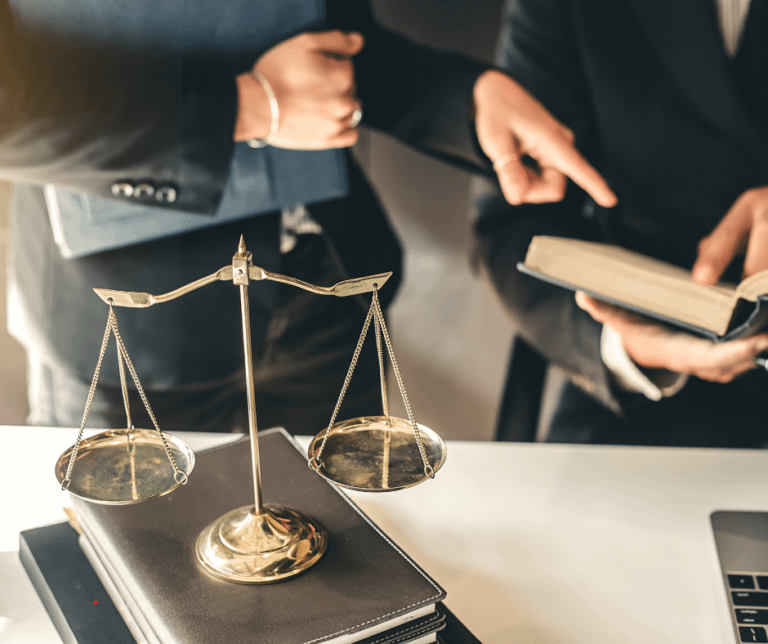 Lawyer and judge in an office, both holding scales of justice, symbolizing fairness and the legal system.
